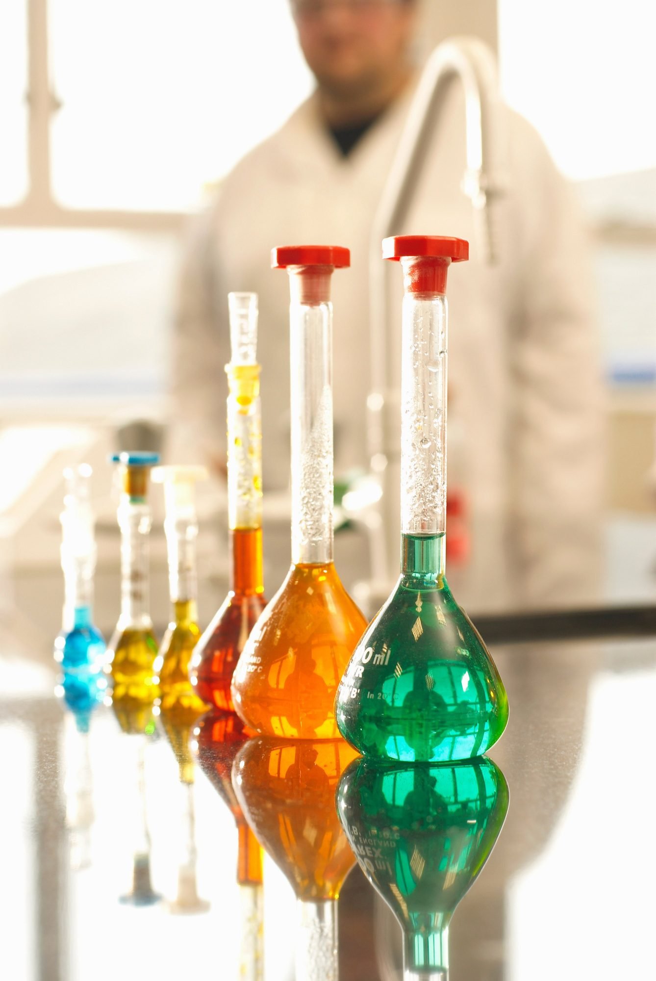 Beakers of liquid in factory